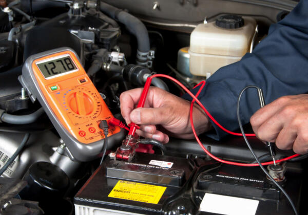 Geelong auto electrician working on machinery engine