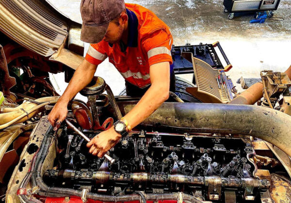 Geelong diesel mechanic working on machine engine