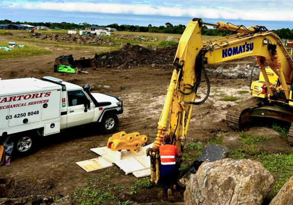 Sartori's diesel mechanic performs a hitch replacement on Komatsu heavy machinery on site in Teesdale