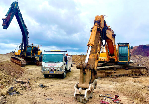 Two excavators in Anakie being serviced by Sartori's Mechanical Services